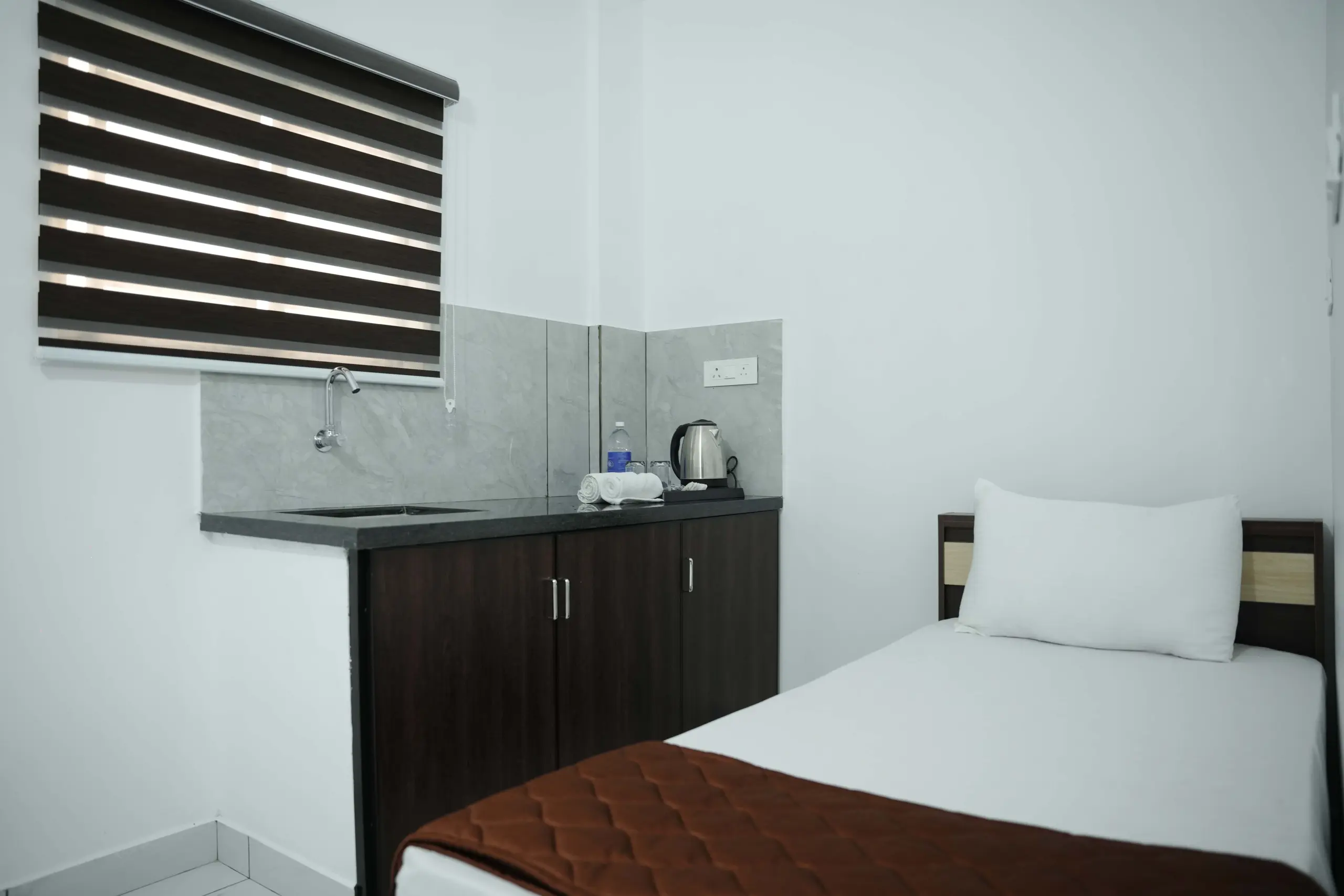 Suite Room – Experience elegant comfort and modern luxury at Gold Suite Hotel, Kakkanad.
